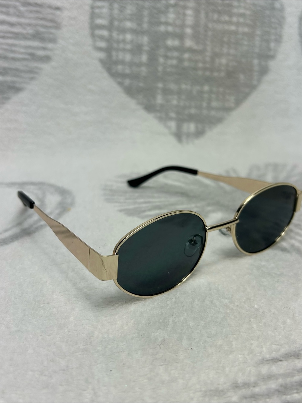 Gold rimmed looking glasses